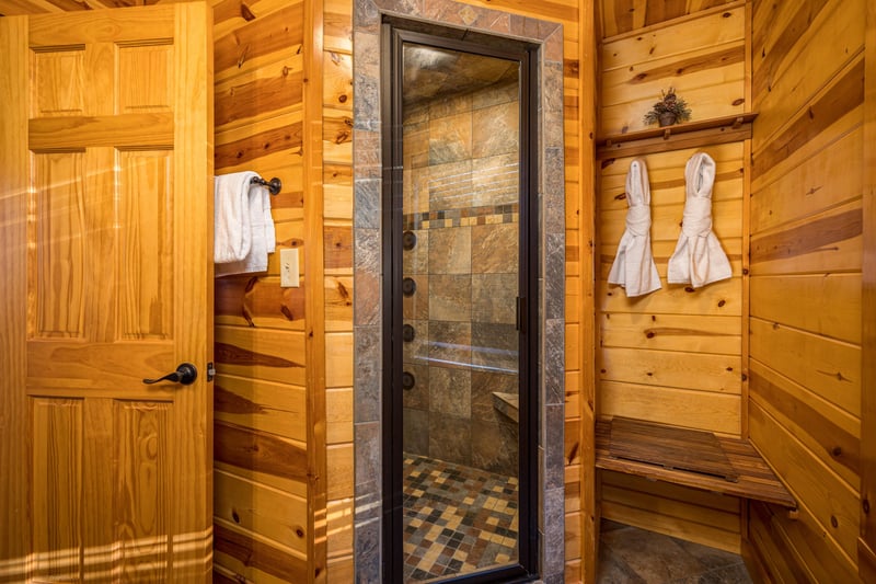 Walk in shower with tile walls