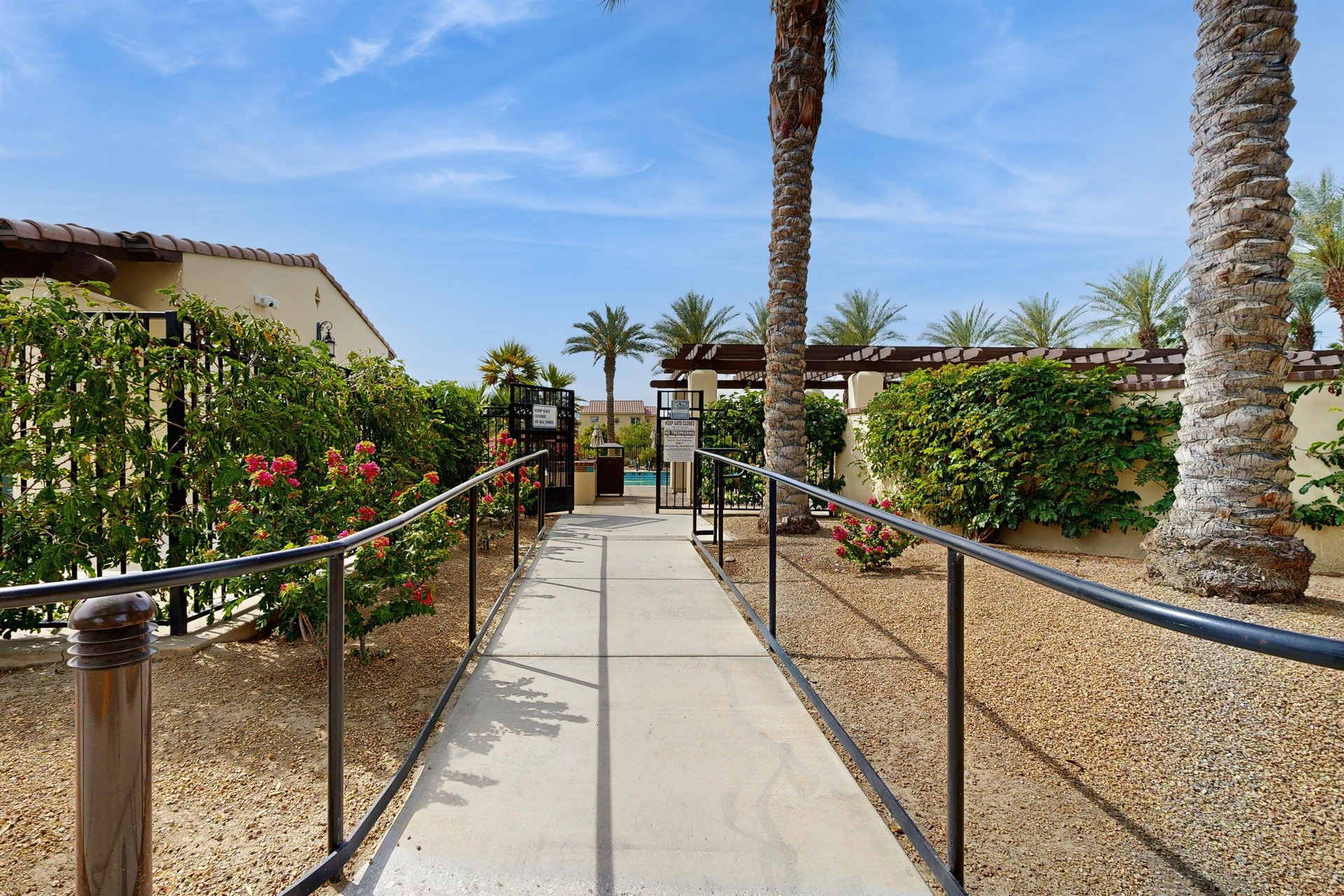 Walkway leading to the shared pool and hot tub.