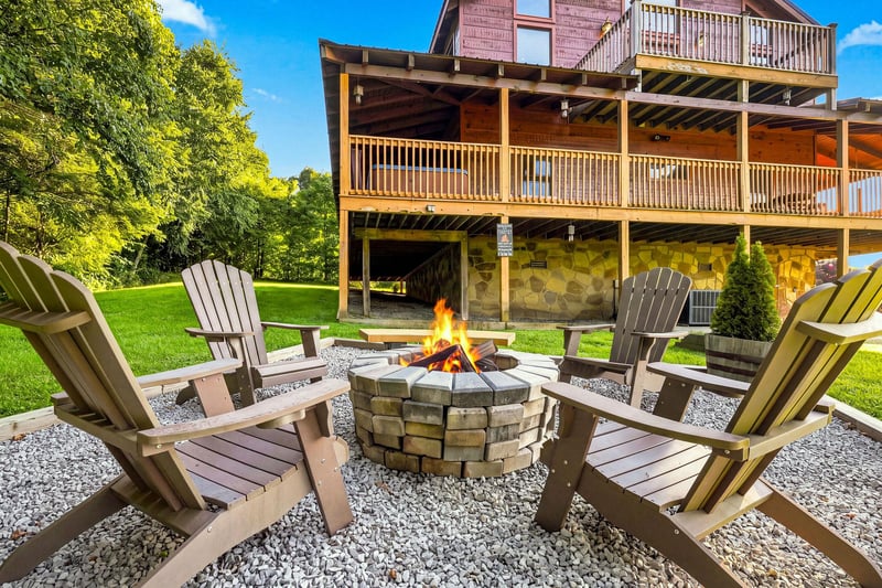 Gather around the fire pit on a sunny afternoon with Adirondack chairs perfectly positioned for storytelling and stargazing, backed by lush lawns and mountain views.