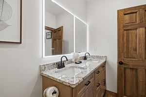 Unwind in your elegantly appointed bathroom with dual vanities, granite countertops, and LEDlit mirror for perfect morning routines.