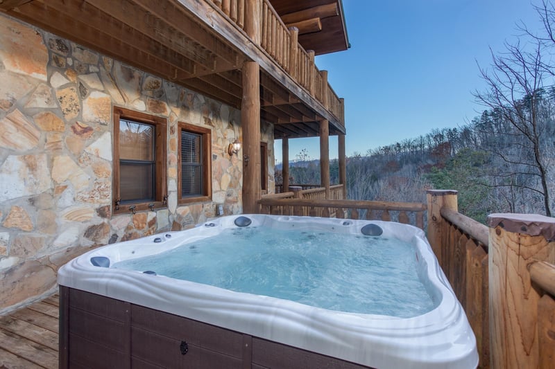 Hot tub with mountain views on an open deck at Great View Lodge, a 5bedroom cabin rental located in Pigeon Forge