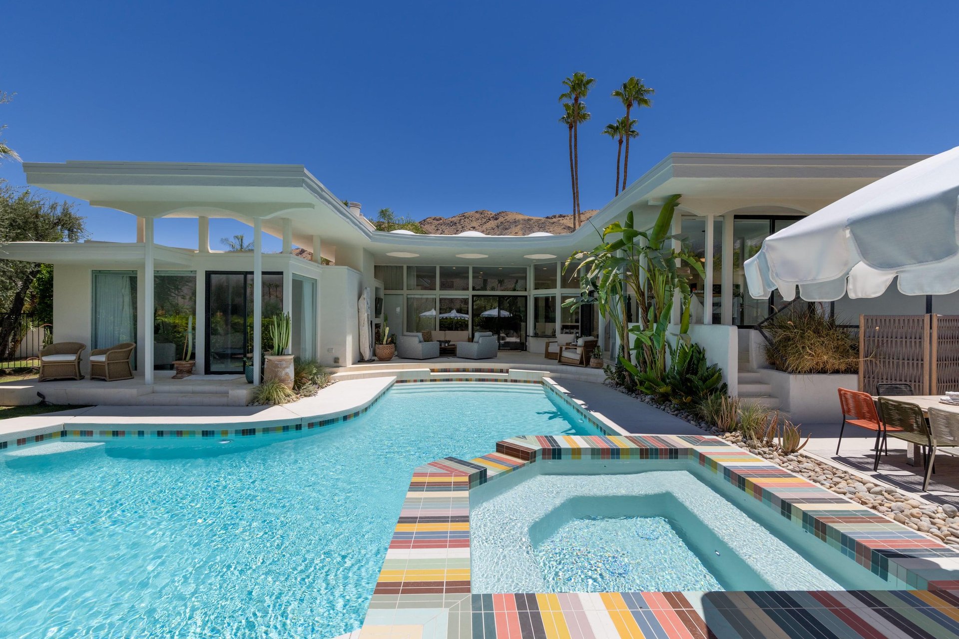 Private pool, spa, sun loungers with umbrellas, outdoor dining, fireplace, BBQ, and plenty of outdoor seating. Stunning mountain and golf course views