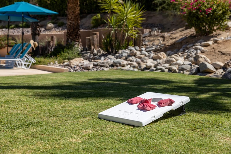 Play a game of cornhole