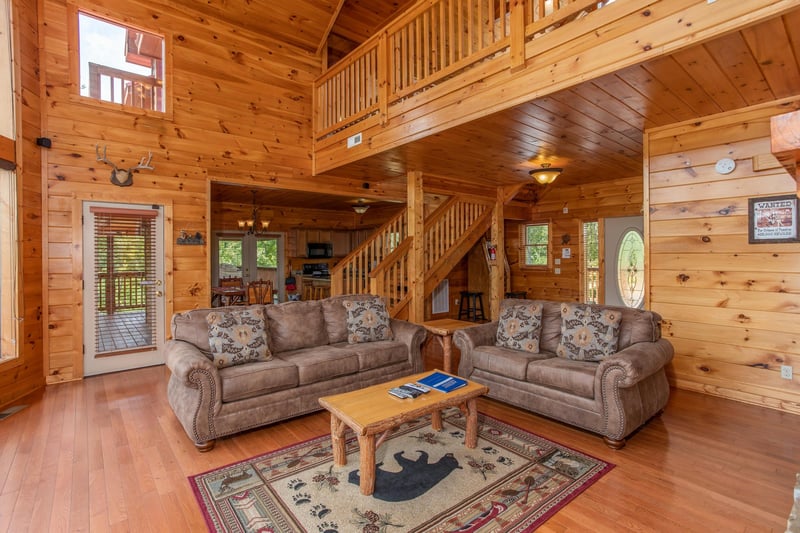 Sofa and loveseat in the living room at Four Seasons Lodge, a 3bedroom cabin rental located in Pigeon Forge