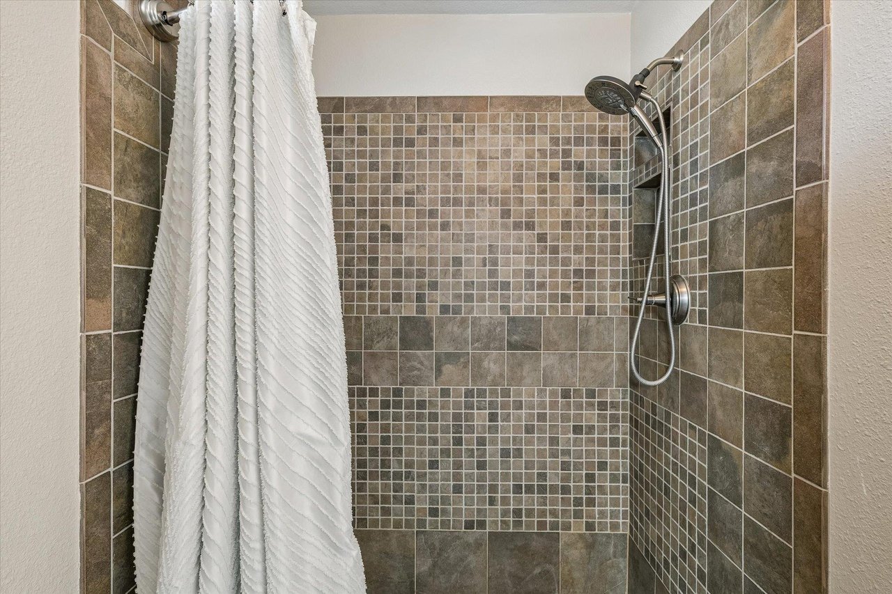 Shower with detachable showerhead.