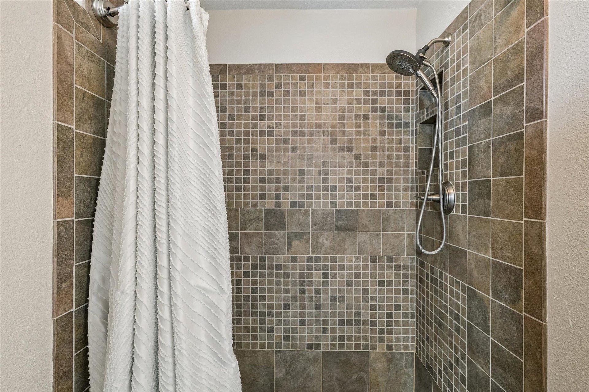 Shower with detachable showerhead.
