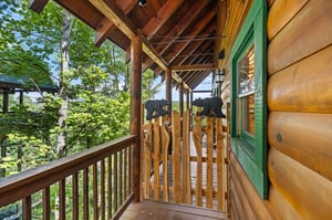 Wooden gate on deck with bear decorations
