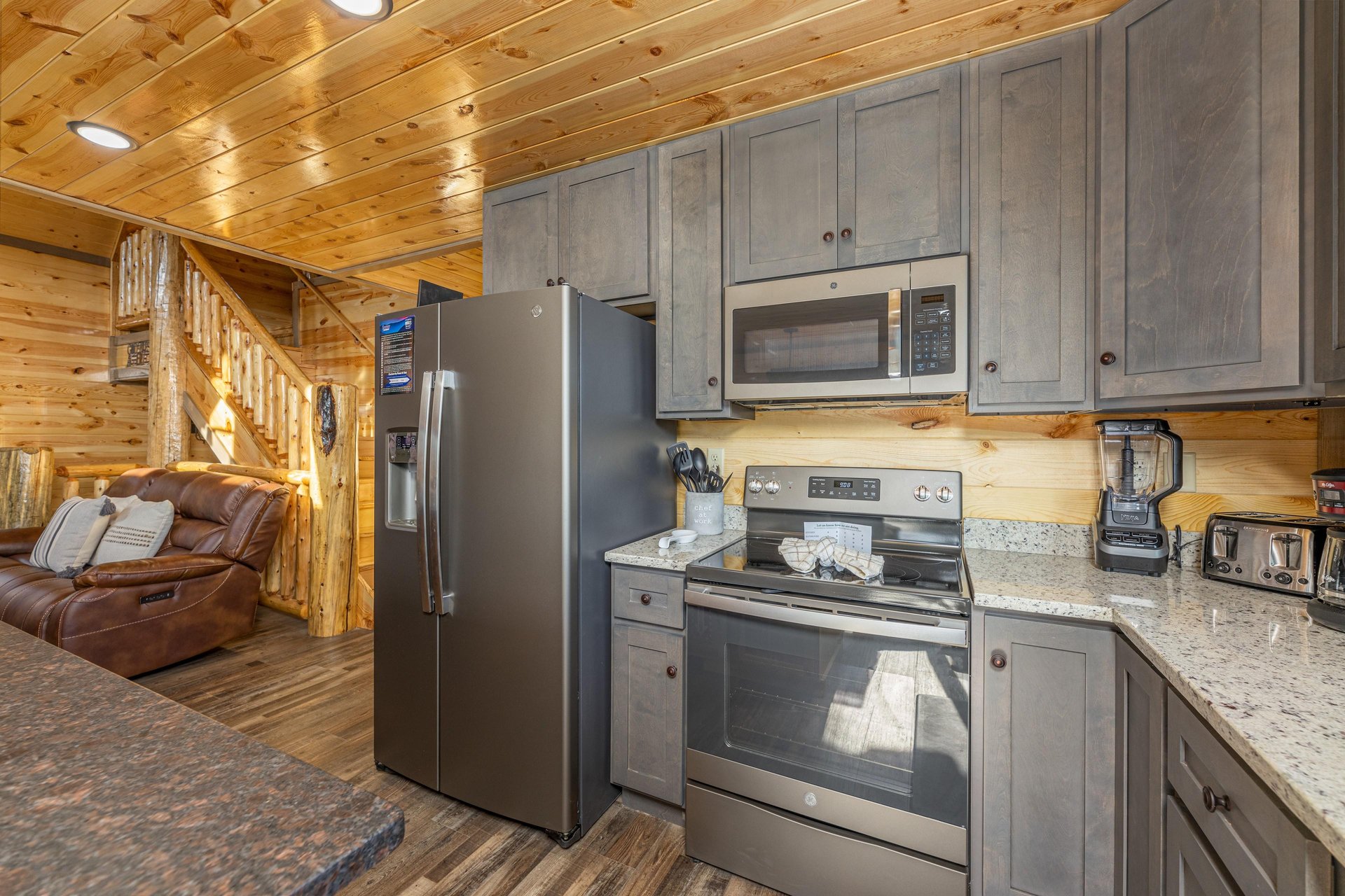 Kitchen with stainless appliances and granite counters at Everlys Splash, a 4 bedroom cabin rental located in Pigeon Forge