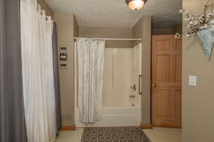 Bathroom with a tub and shower at Bearadise 4 Us, a 3 bedroom cabin rental located in Pigeon Forge