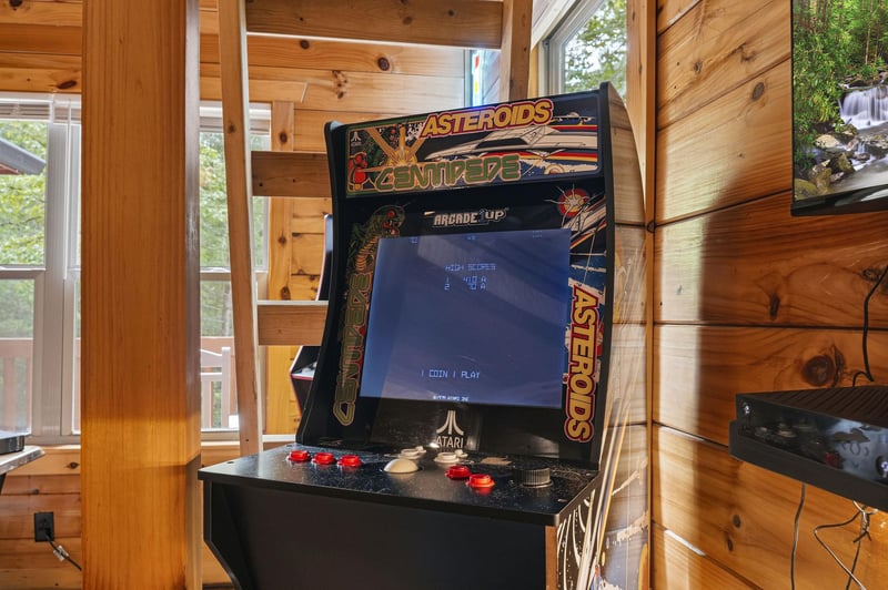 Relive the golden age of gaming with your own classic arcade machine—set against warm wood walls and natural light, its the perfect spot for friendly competition.