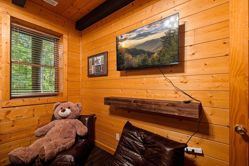 A cozy timberlined room with natural light and rustic charm, perfect for unwinding after exploring the great outdoors.