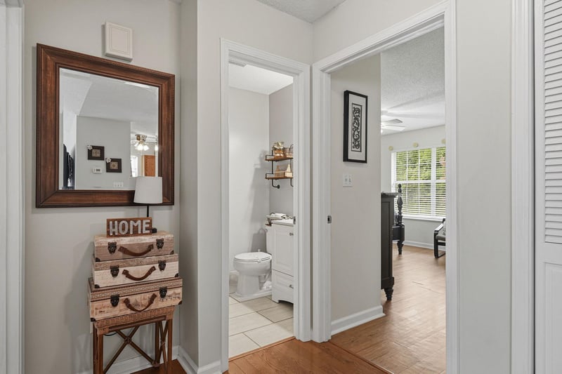 Warm wood floors and thoughtful décor welcome you into this inviting space, where a cozy bedroom awaits just beyond the clean, welllit bathroom.