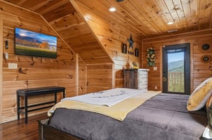 Picture yourself waking in this cozy cabin retreat. Warm wood surrounds you, a mountain view greets you from your private door, and modern comfort meets rustic charm in every detail.