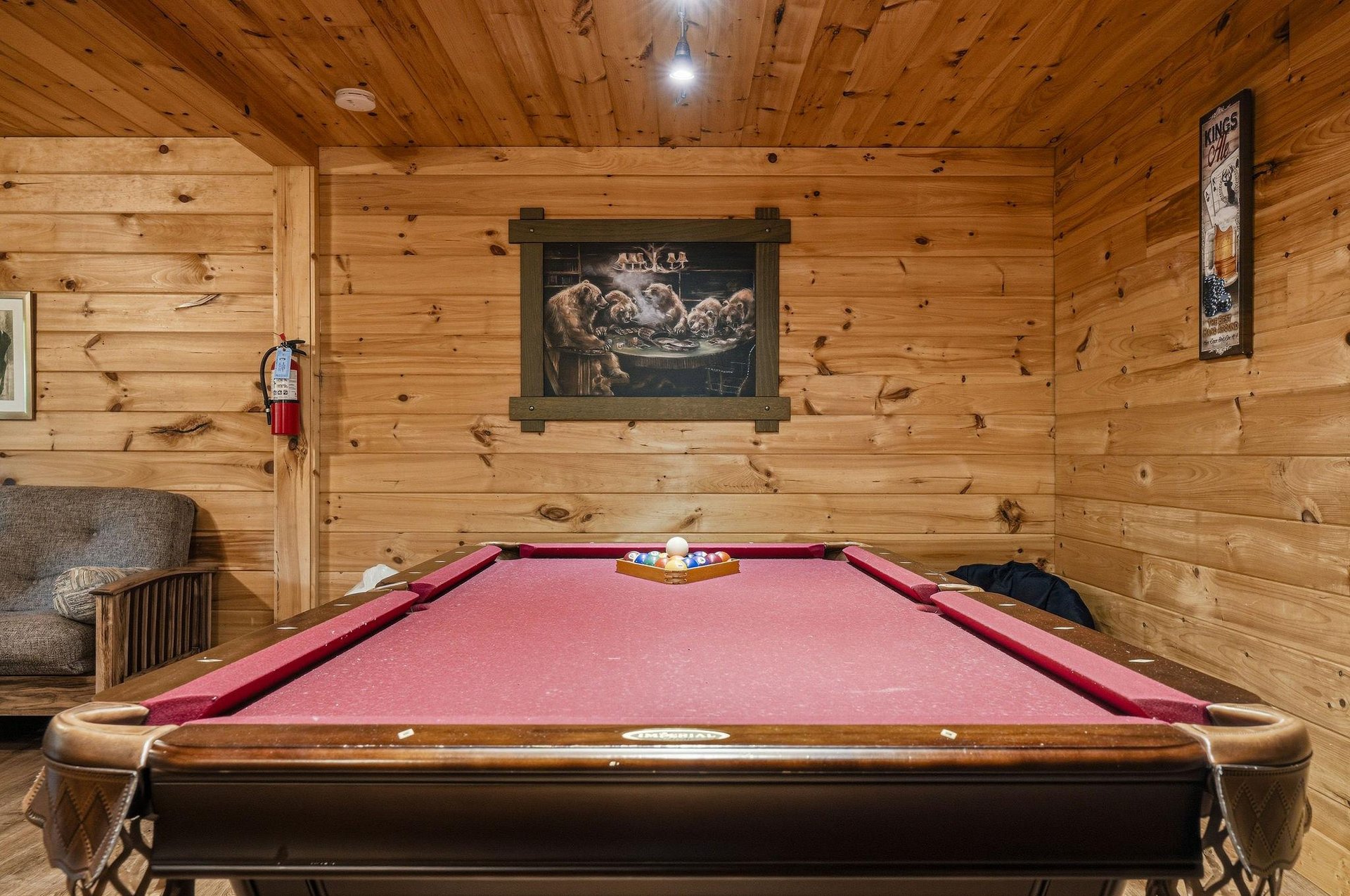 Challenge your group to a friendly game in this warm, woodpaneled game room—complete with a fullsize pool table and cozy seating for cheering on your favorite player.