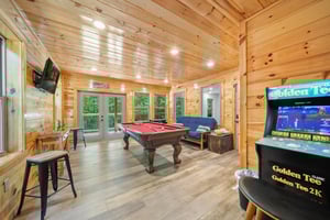 pool table, futon and arcade