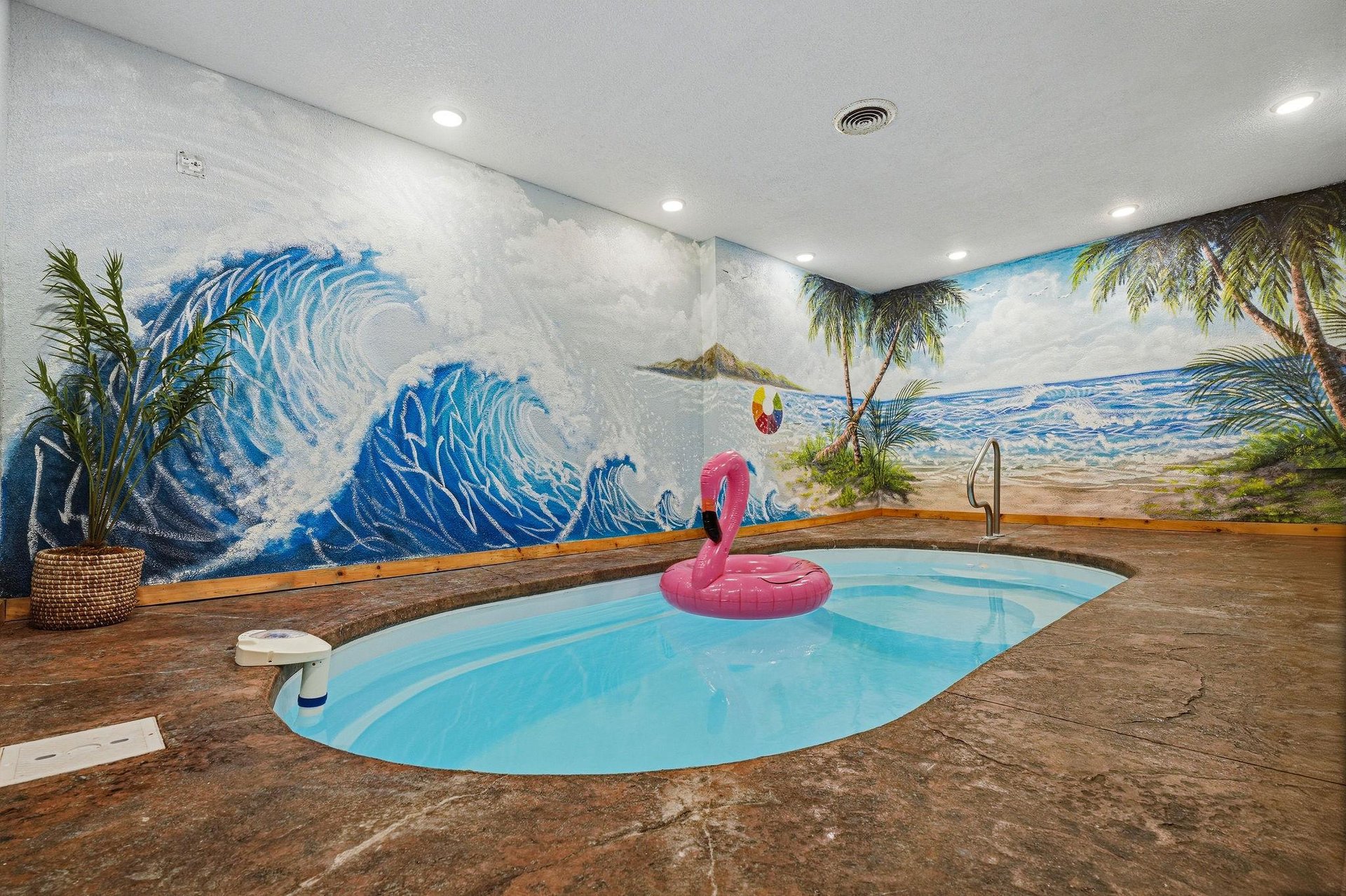 Escape to your own private indoor oasis Youll love lounging in the custom pool surrounded by vibrant tropical murals—perfect for yearround relaxation and fun.