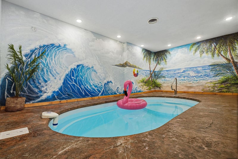 Escape to your own private indoor oasis Youll love lounging in the custom pool surrounded by vibrant tropical murals—perfect for yearround relaxation and fun.