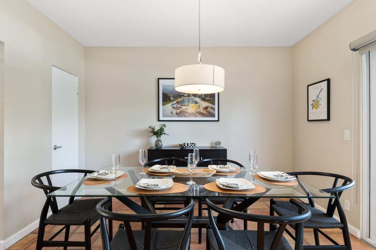 On the other side of the front entry is the dining area with a table that fits up to 6 guests.