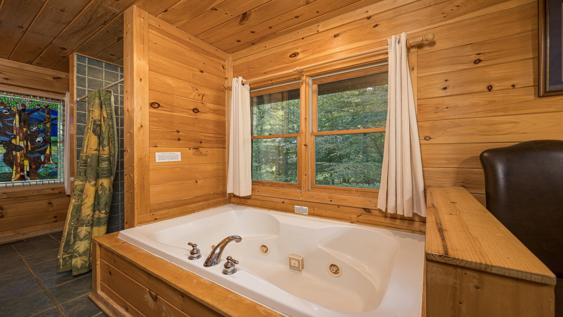 Soaker tub with windows