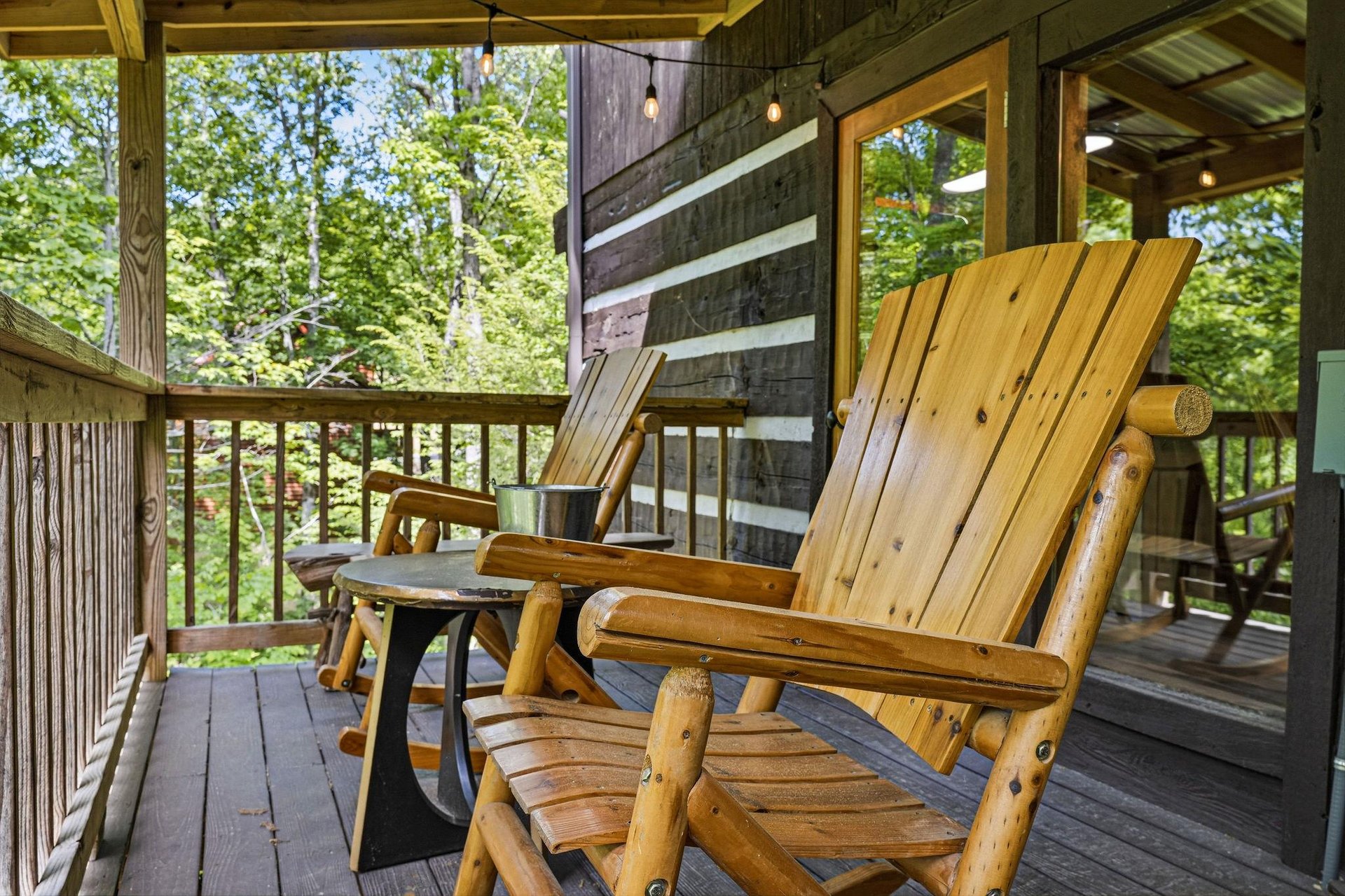Settle into these handcrafted wooden chairs and enjoy your morning coffee surrounded by peaceful forest views. Your private covered deck is perfect for unwinding after a day of adventure.