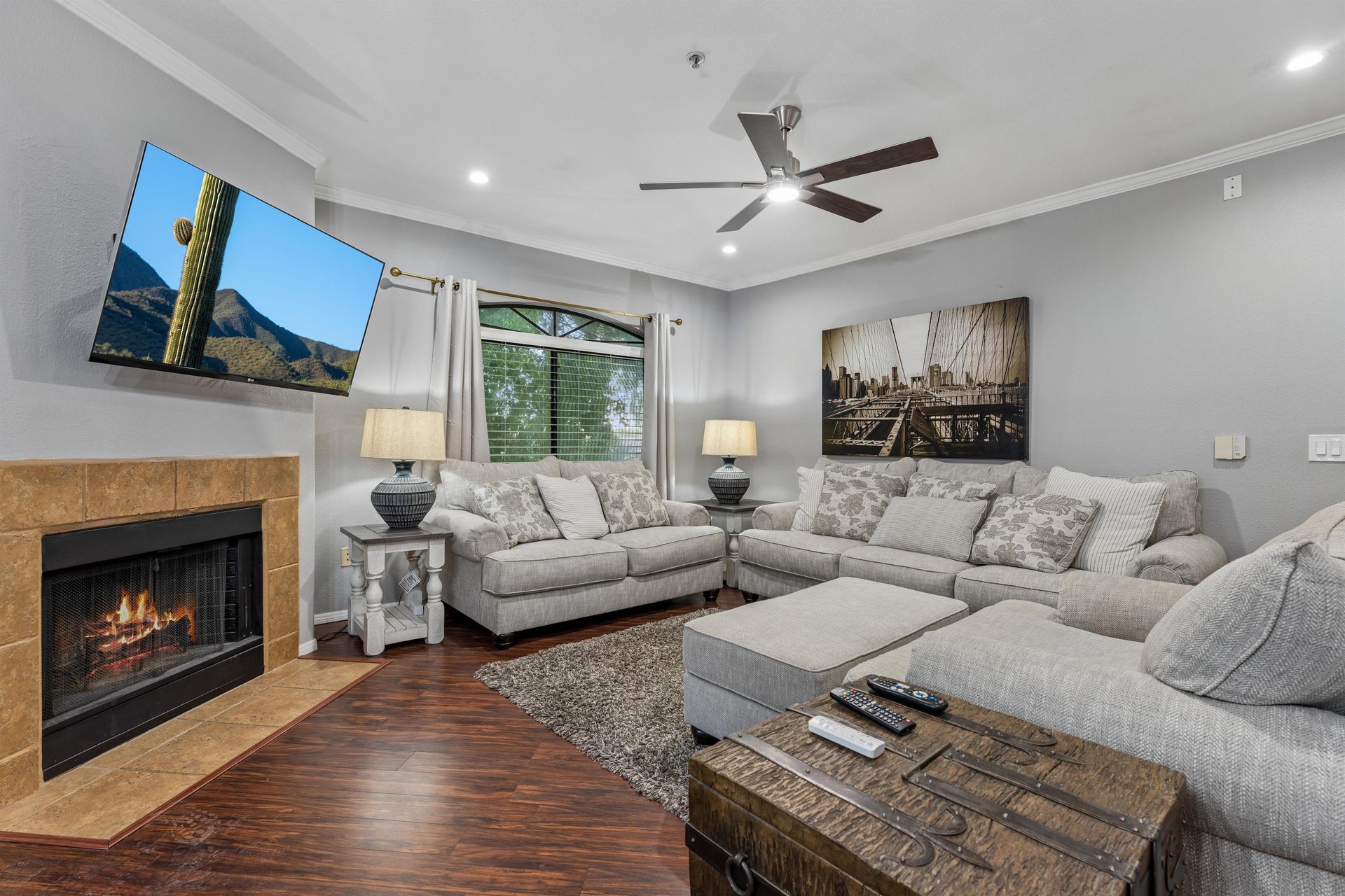 Ample seating, fireplace, and flatscreen TV.
