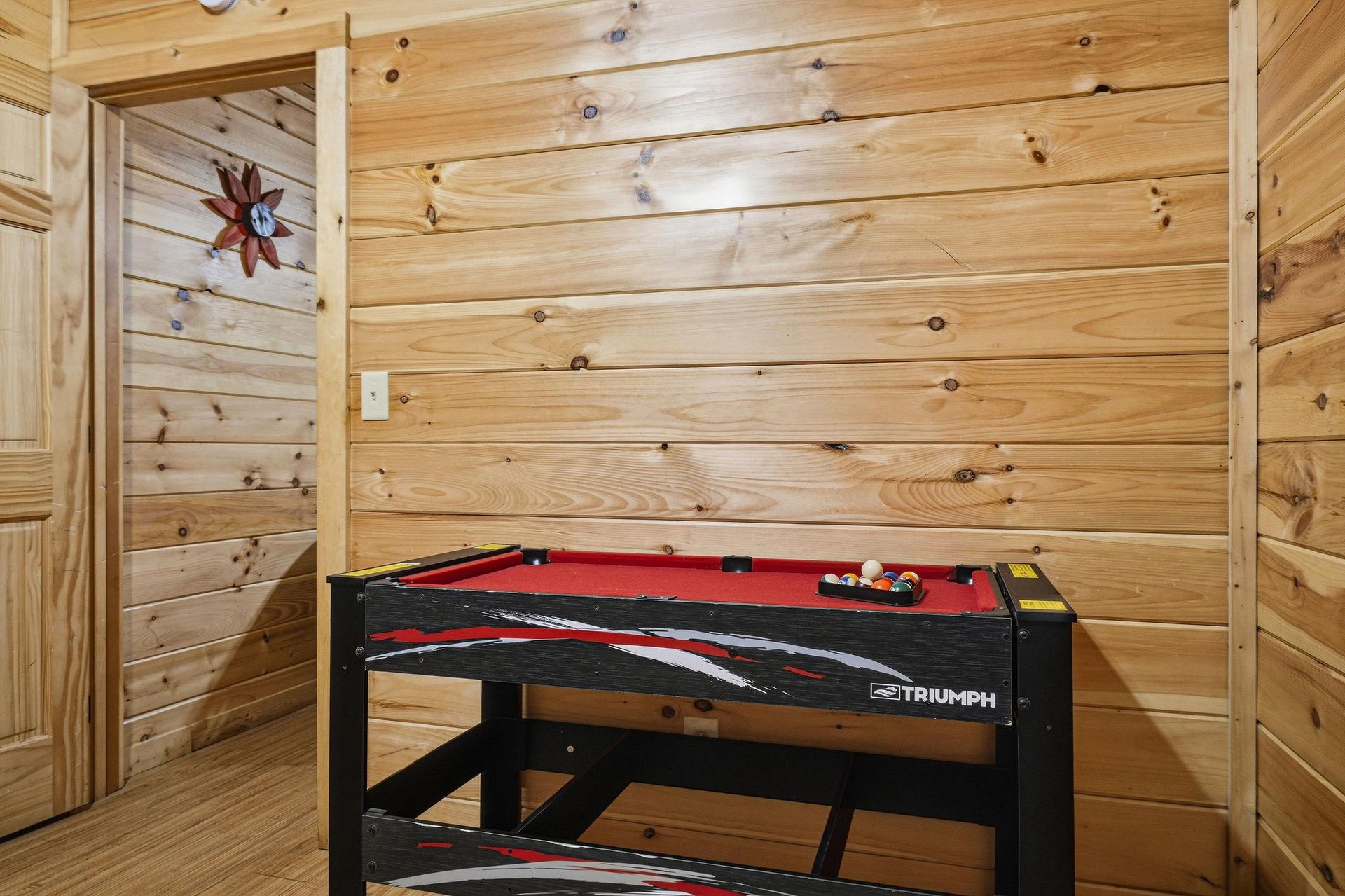 Challenge your family to a friendly game on your own pool table in this cozy woodpaneled game room.