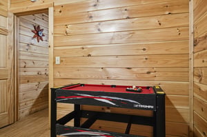 Challenge your family to a friendly game on your own pool table in this cozy woodpaneled game room.