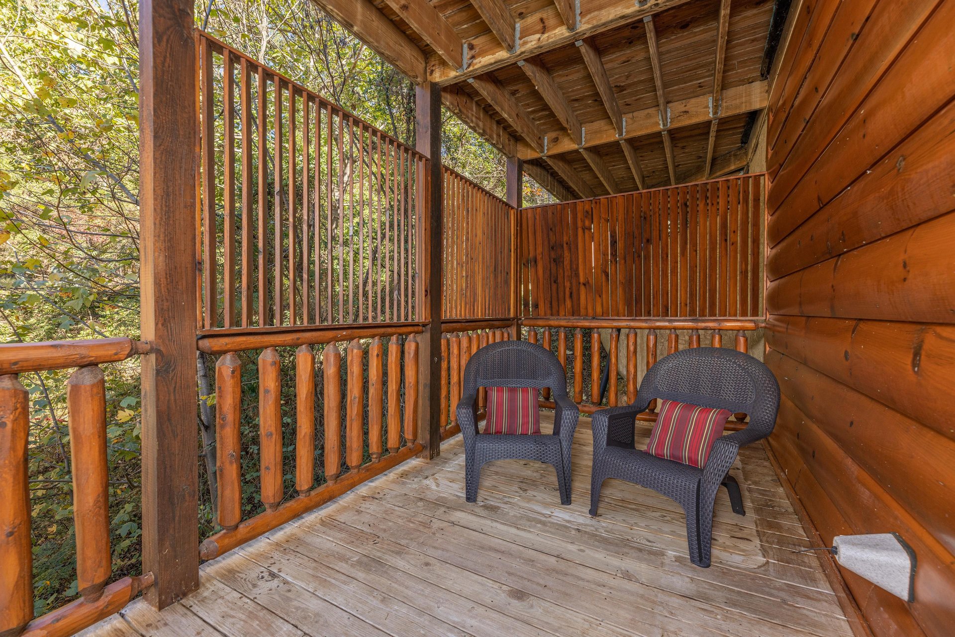 Privacy fence and deck chairs at Bears Dont Bluff, a 3 bedroom cabin rental located in Pigeon Forge