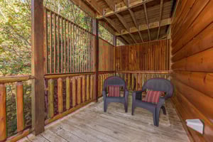 Privacy fence and deck chairs at Bears Dont Bluff, a 3 bedroom cabin rental located in Pigeon Forge