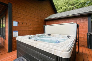 Slip into warm, bubbling water on your private deck, surrounded by lush greenery and the peaceful quiet of nature.