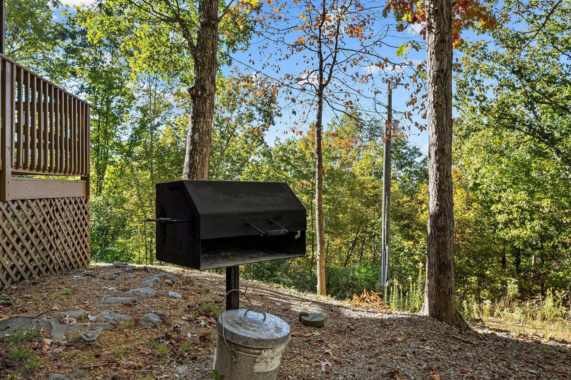 Park grill and trash can
