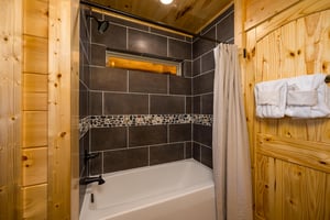 single person tile bathtub with peak window