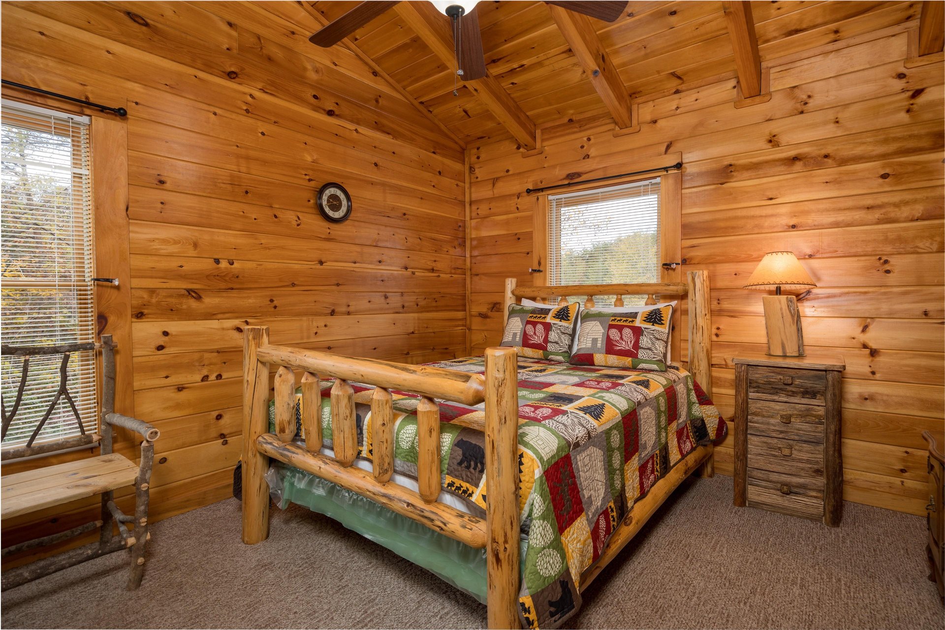 Bedroom with Nightstand and Bench at Enchanted Forest