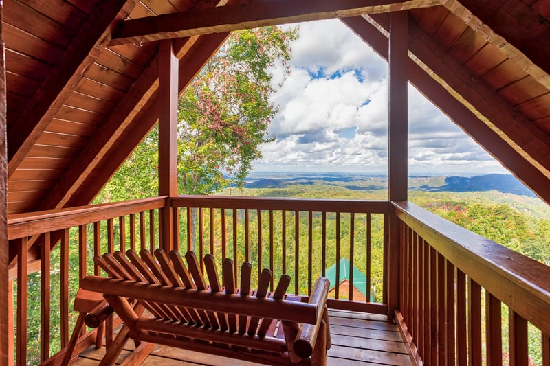 Top deck with bench and view at EllaVation, a 3 bedroom cabin rental located in Gatlinburg