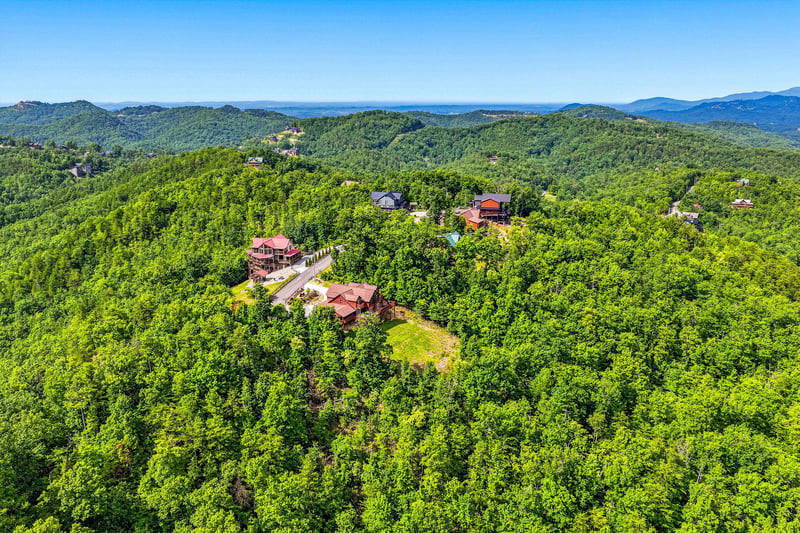 Nestled in lush mountain forest with breathtaking blue ridge views, the property offers serene seclusion while remaining connected to neighboring homes and scenic surroundings.