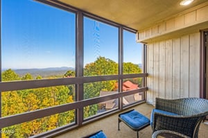 Your private balcony offers stunning mountain views where you can unwind with morning coffee while surrounded by colorful autumn foliage.
