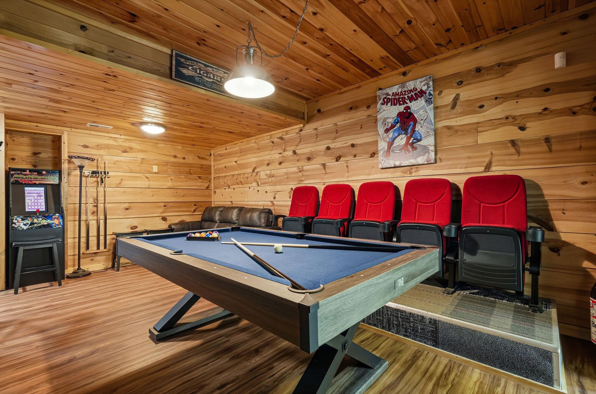 Your own private game room awaits with a pool table, arcade fun, and cozy theater seating—perfect for friendly competition or movie nights with loved ones.
