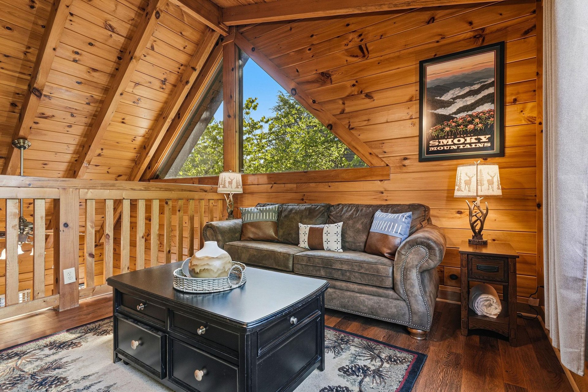 Curl up in your cozy loft living area with vaulted wood ceilings and leather seating, perfect for unwinding after mountain adventures.