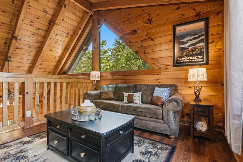 Curl up in your cozy loft living area with vaulted wood ceilings and leather seating, perfect for unwinding after mountain adventures.