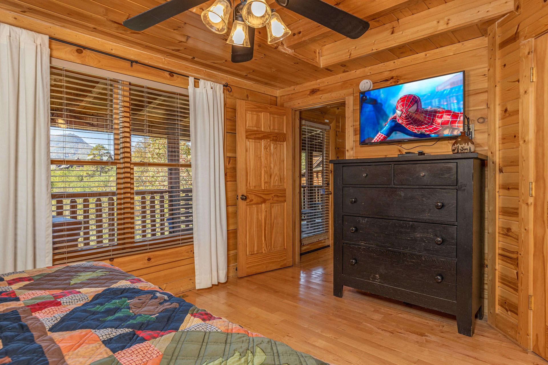 Dresser and TV in a bedroom at Bears Dont Bluff, a 3 bedroom cabin rental located in Pigeon Forge
