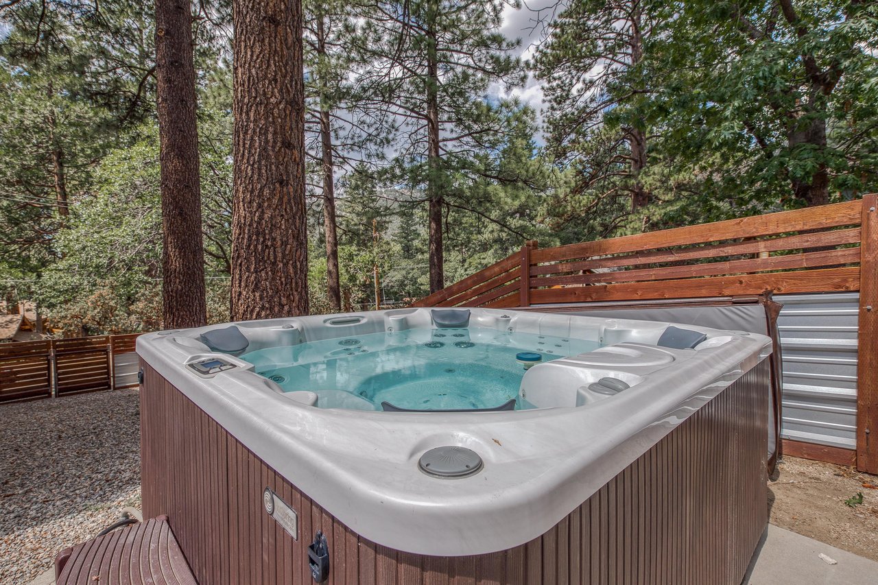 Soak under the stars for a romantic evening, or unwind here after a day of family adventures — this private hot tub sits in the fully fenced backyard patio.