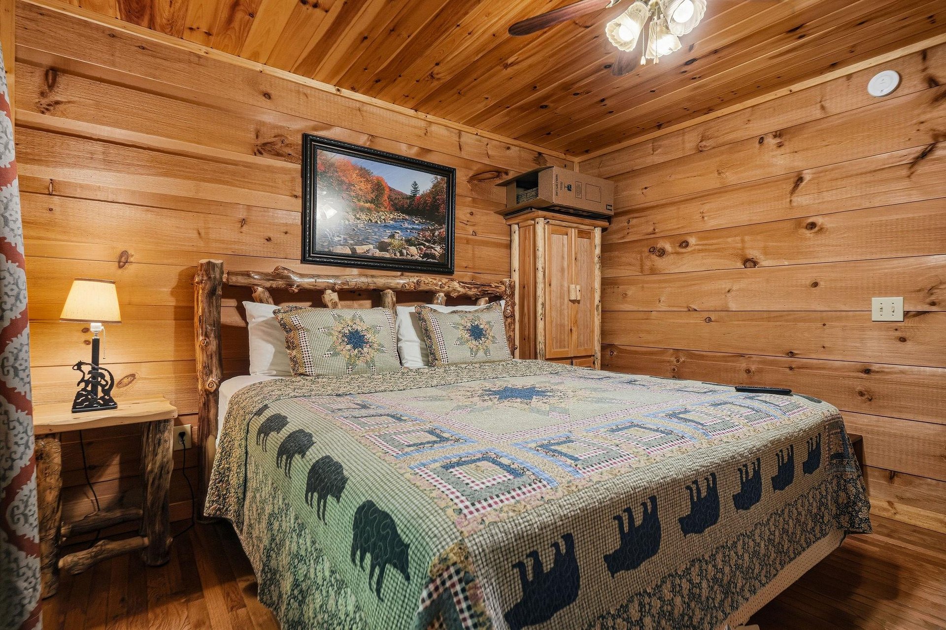Sink into rustic charm in your private bedroom, where natural wood walls embrace a handcrafted log bed dressed in wildernessthemed linens that make every night feel like a cozy cabin retreat.