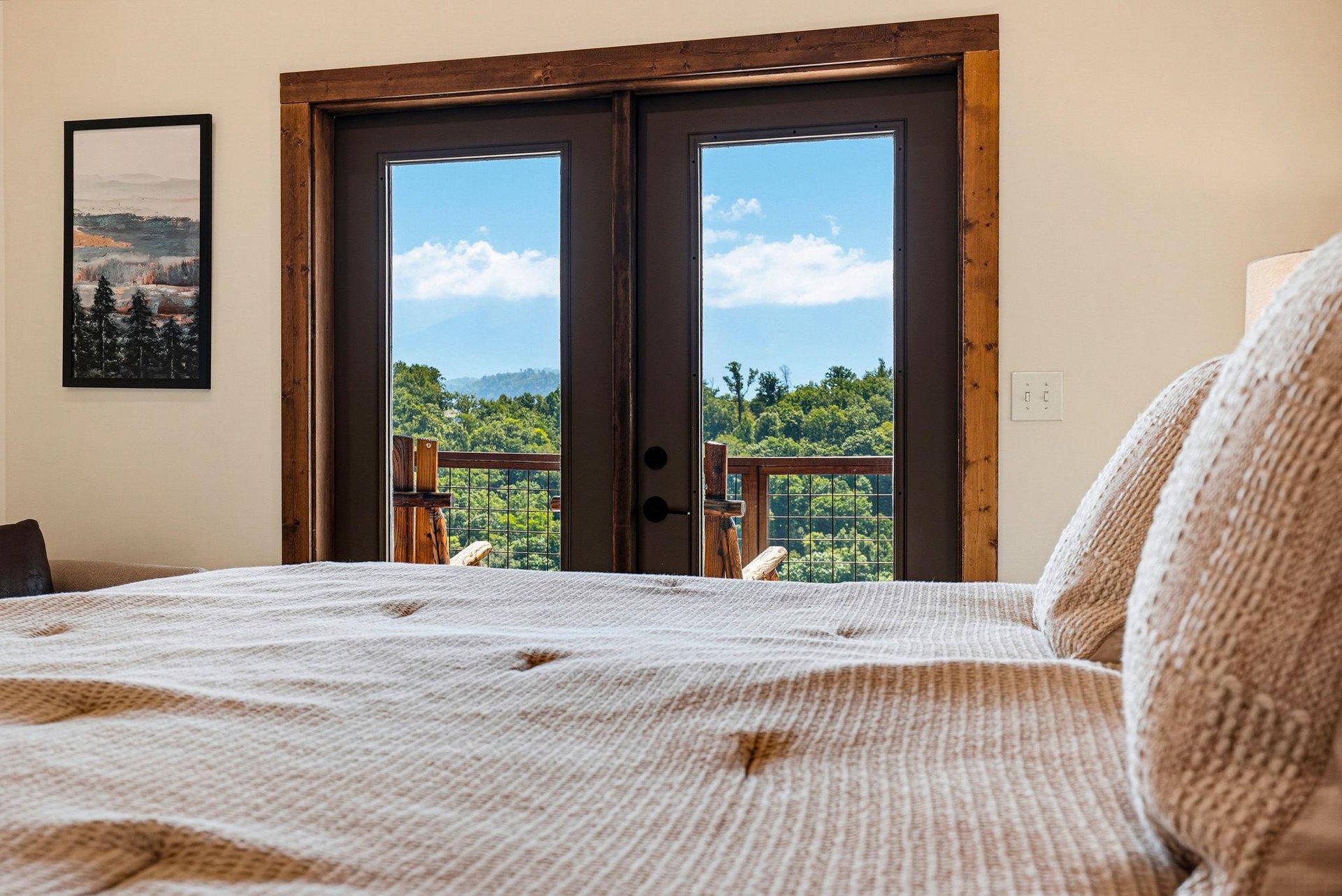 Wake up to stunning mountain views framing your private balcony. Cozy linens invite you to sink in while the peaks beckon just beyond your glass doors.