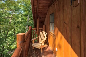 Deck off the game room at Dreams Do Come True, a 1bedroom cabin rental located in Pigeon Forge