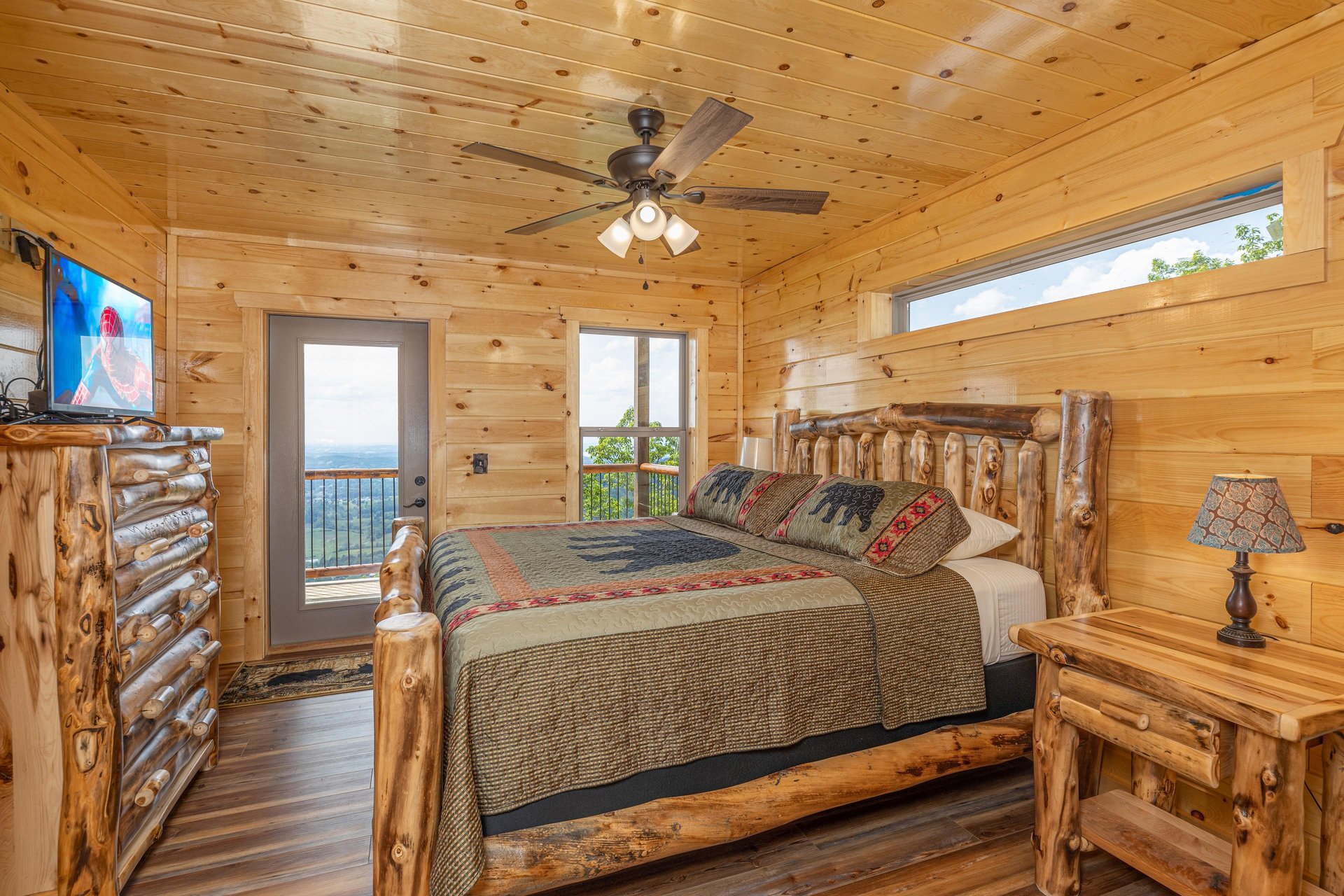 King bed with window and door to deck