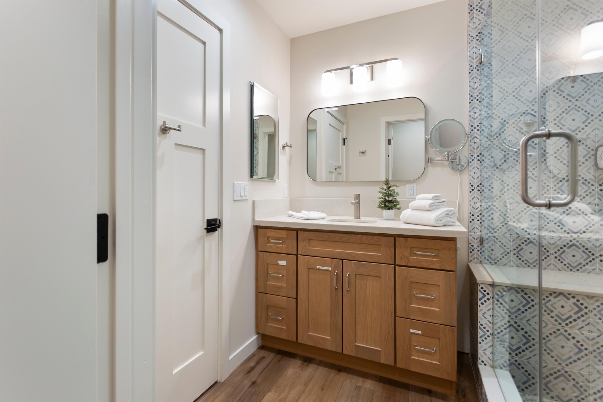 Upstairs with a step in shower and shower seat.