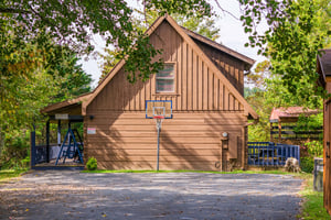 basketball goal behind cabin