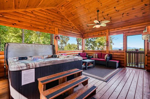 Unwind in your private hot tub while soaking in stunning mountain views, then relax on the covered deck with plush seating and a gentle breeze.