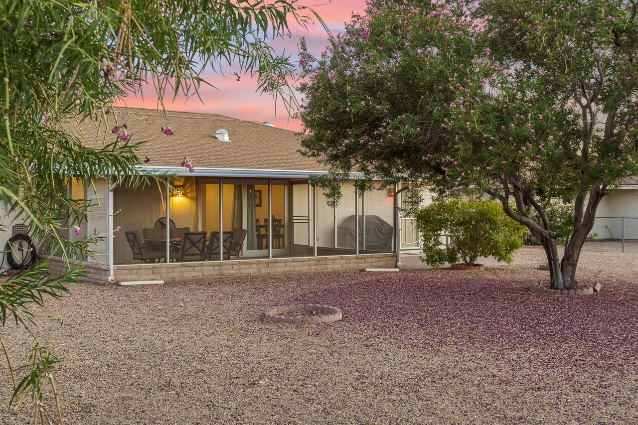 Screened patio with fan, and outdoor dining table and chairs for 6 guests. Large outdoor space in backyard with BBQ, additional table, and fencedin yard.