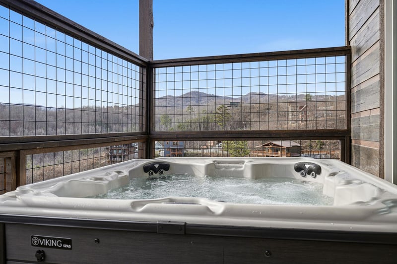 Soak in your private hot tub while taking in stunning mountain views from this peaceful terrace retreat.